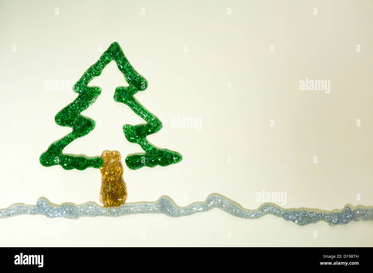 Christmas tree made of shiny gel over white paper. Copy spice Stock Photo