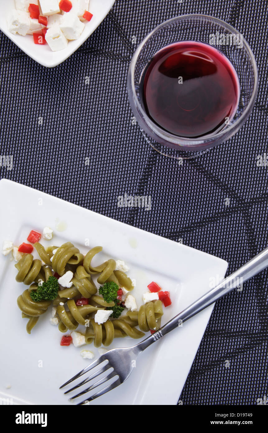 pasta salad with feta cheese and a glass of wine Stock Photo