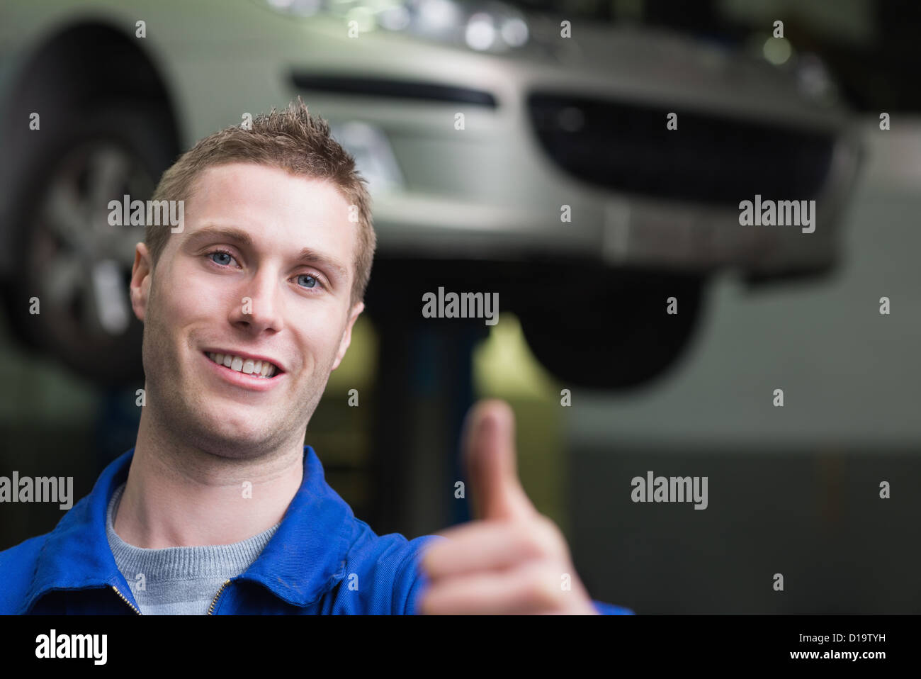 Car mechanic gesturing thumbs up Stock Photo Alamy