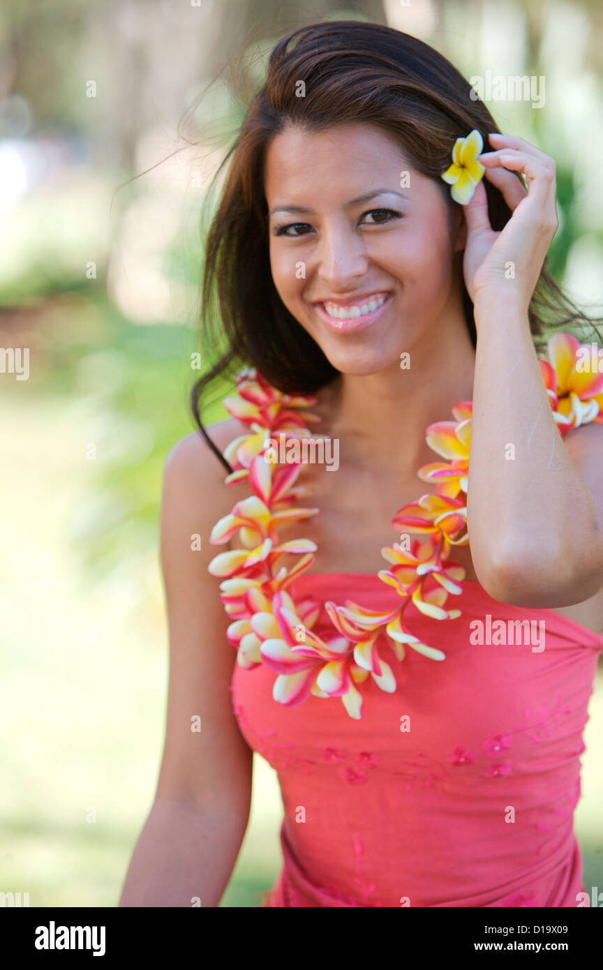 Hawaii, Oahu, Local Girl Holding Yellow Plumeria Behind Her Ear And A