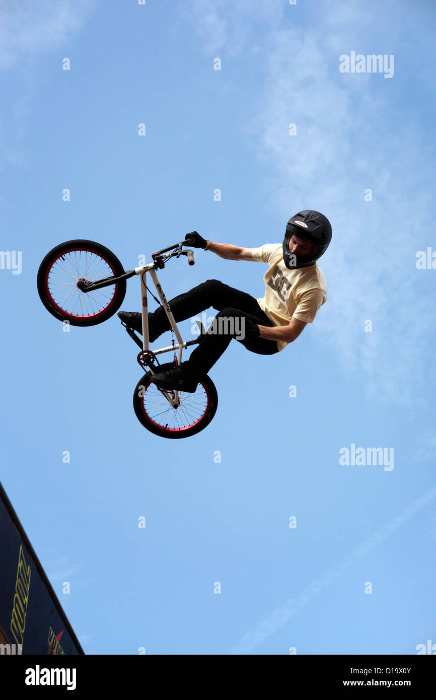 BMX Biker turns at the top of a vert ramp at the White Air festival, Brighton, UK. Stock Photo