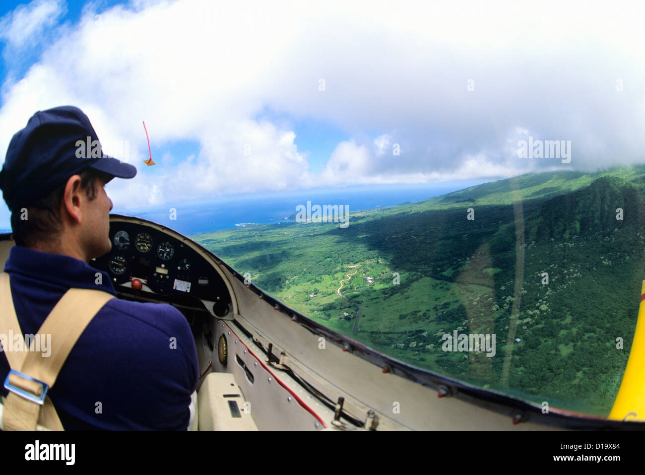 Hawaii, Maui, Yellow Glider Over Hana, View Of Pilot. Stock Photo