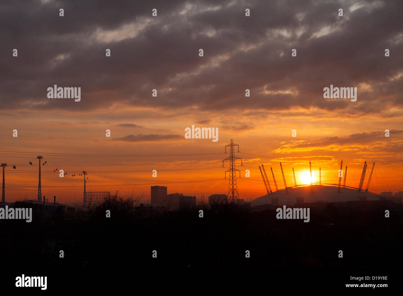 London, UK. 12th December 2012. Sunset over The O2 arena from East ...