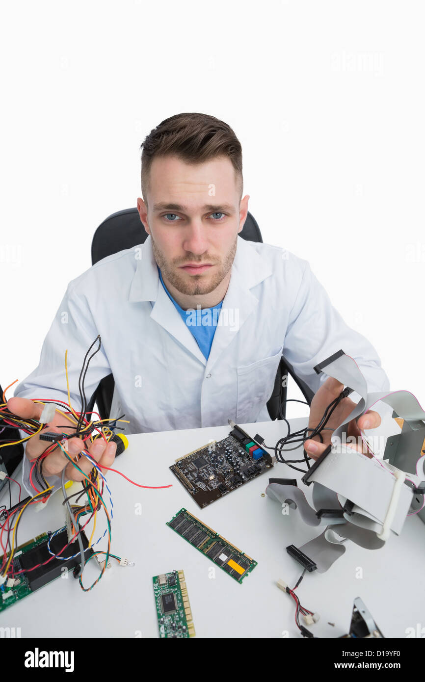 Portrait of confused computer engineer with cpu parts Stock Photo Alamy