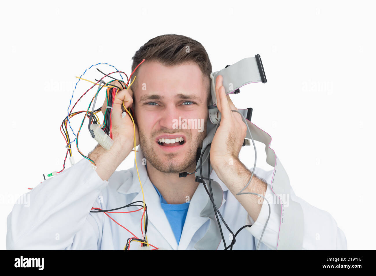 Young it professional yelling with cables in hands Stock Photo
