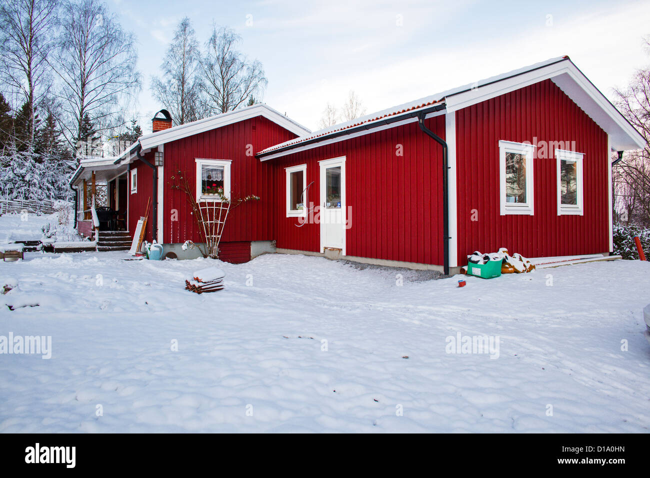 Red cottage in snow in Sweden. Property release available Stock Photo