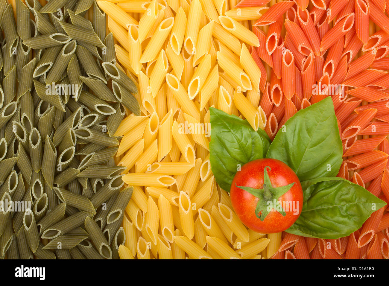 Pasta Italian flag texture with tomato and basil Stock Photo
