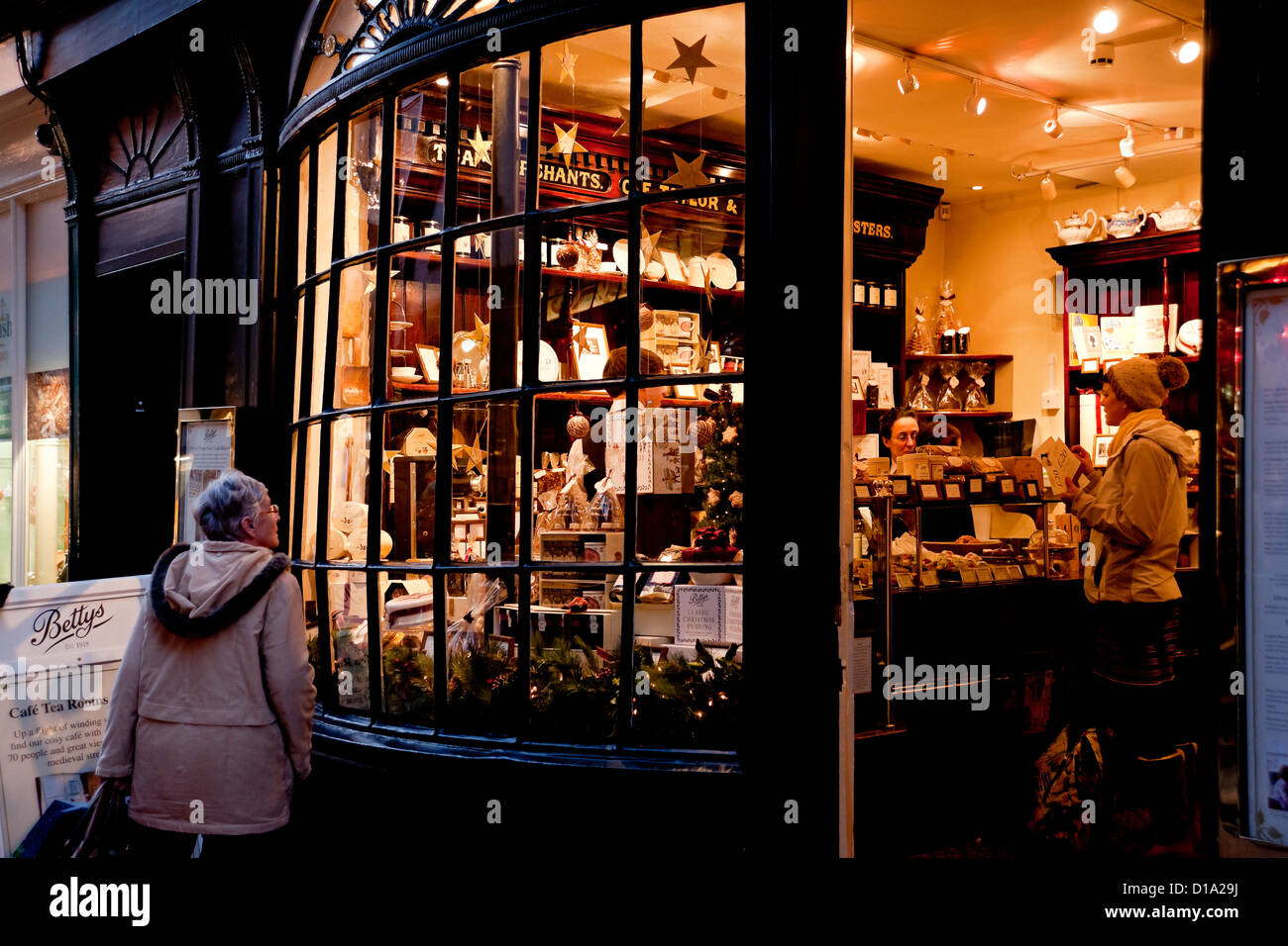 Little Bettys shop store window at night evening Christmas Stonegate York North Yorkshire England UK United Kingdom GB Great Britain Stock Photo