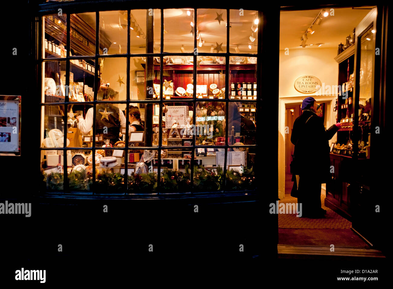 Little Bettys shop store window at night evening Christmas Stonegate York North Yorkshire England UK United Kingdom GB Great Britain Stock Photo
