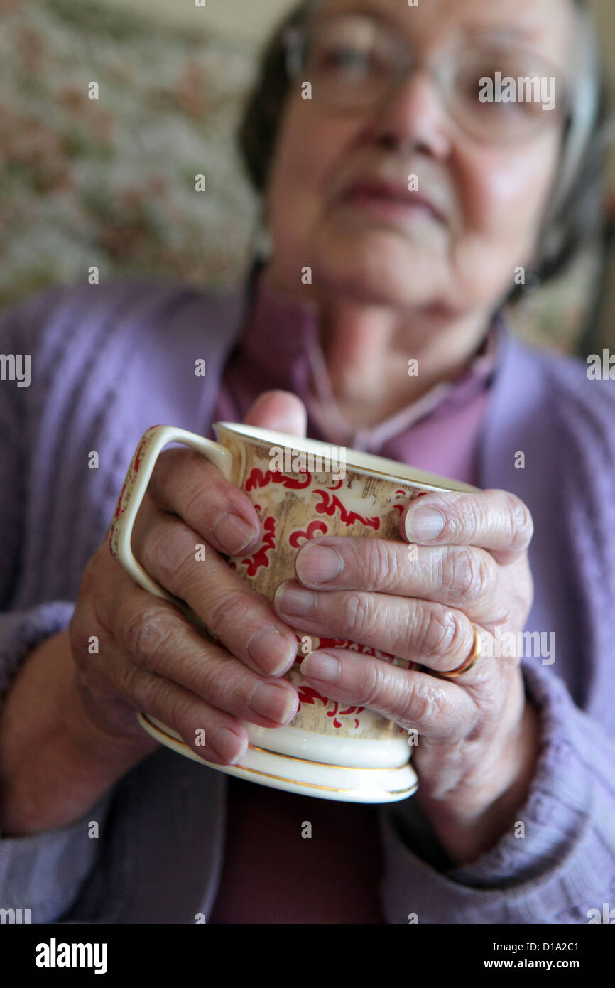 Elderly woman in cardigan hi-res stock photography and images - Alamy