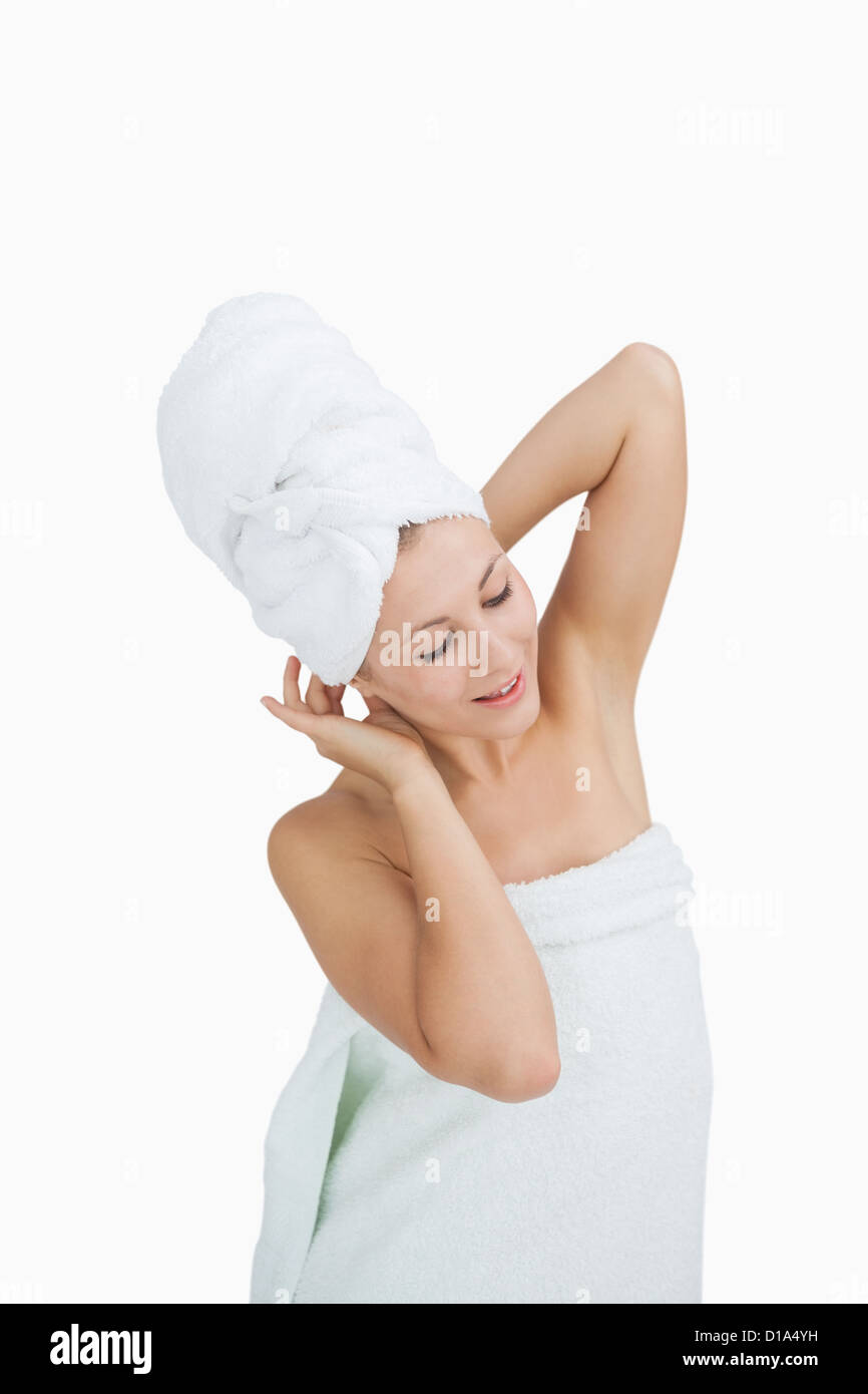 Happy young woman wrapped in towel Stock Photo - Alamy