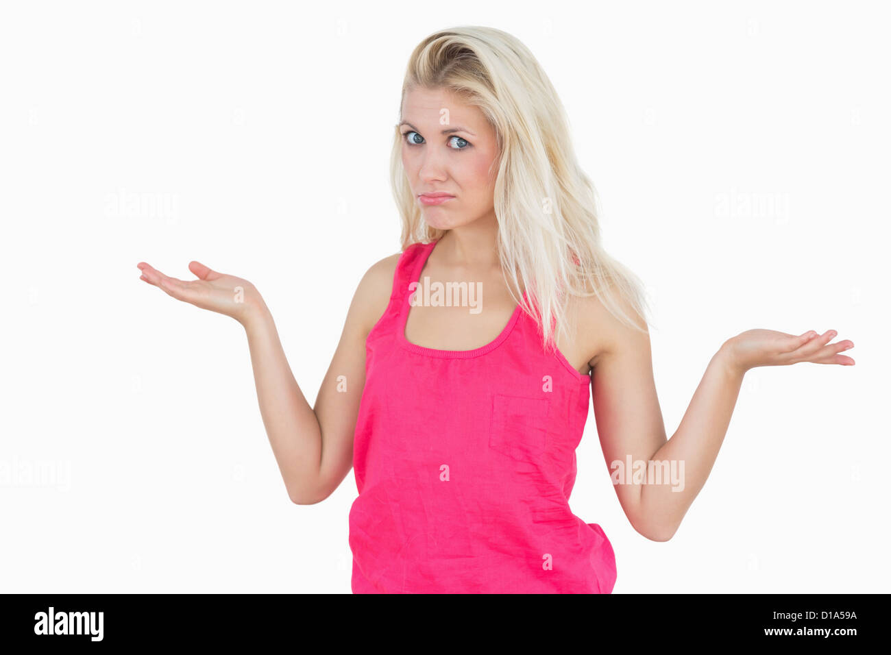 Beautiful young woman gesturing do not know sign Stock Photo