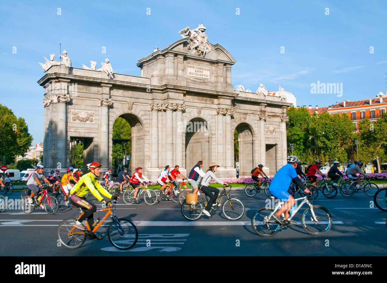 People riding bike in the Bike Party. Alcala Gate, Madrid, Spain. Stock Photo