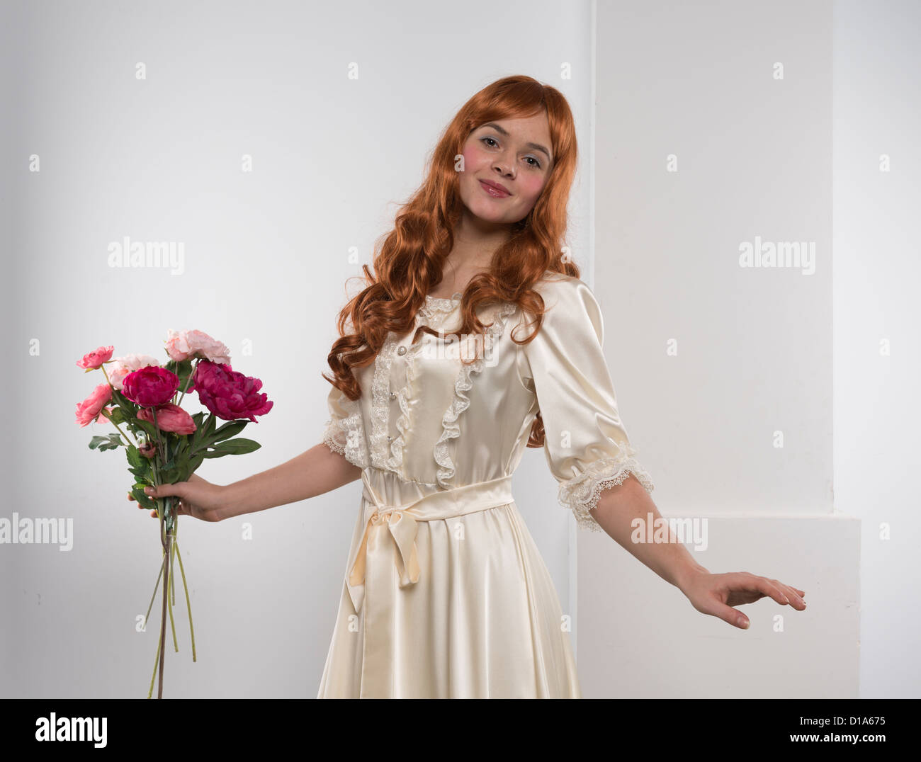 actor costume carnival theatre play person posing one young red woman flowers gown Stock Photo