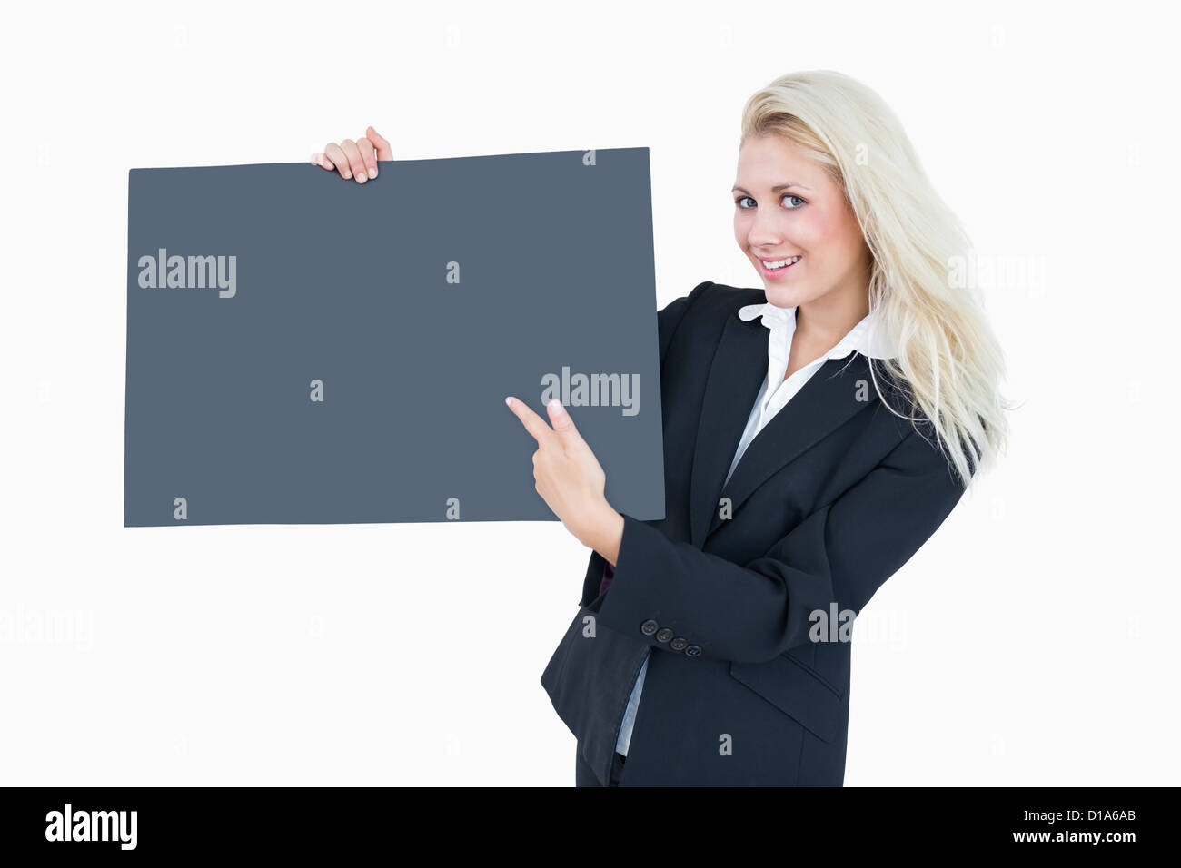 Portrait of business woman pointing at empty banner Stock Photo