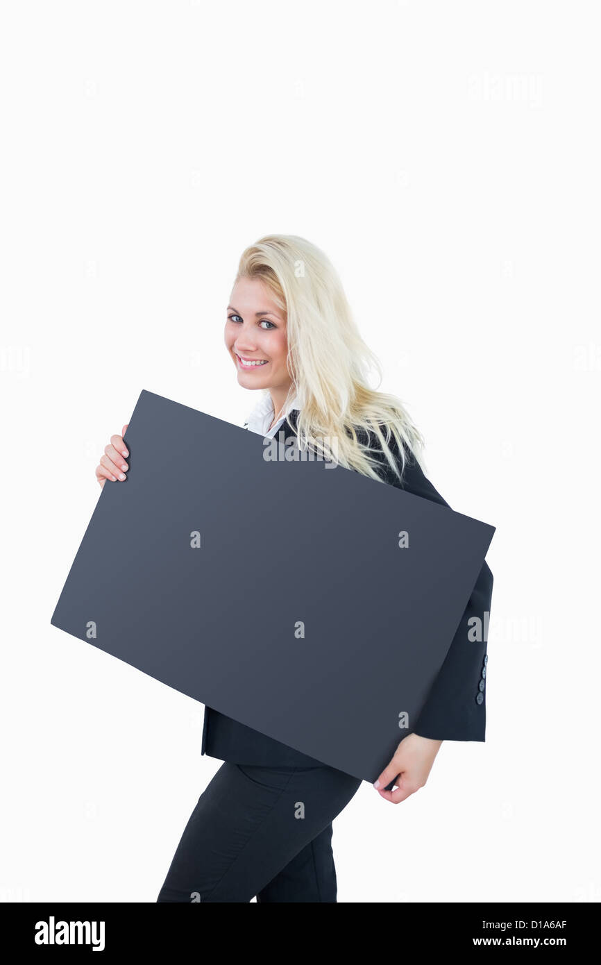 Portrait of business woman holding empty banner Stock Photo