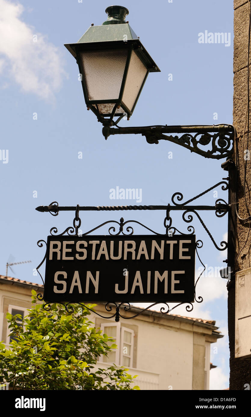 wrought iron restaurant sign and lamp.  Santiago de Compostela, Galicia, Spain. Stock Photo