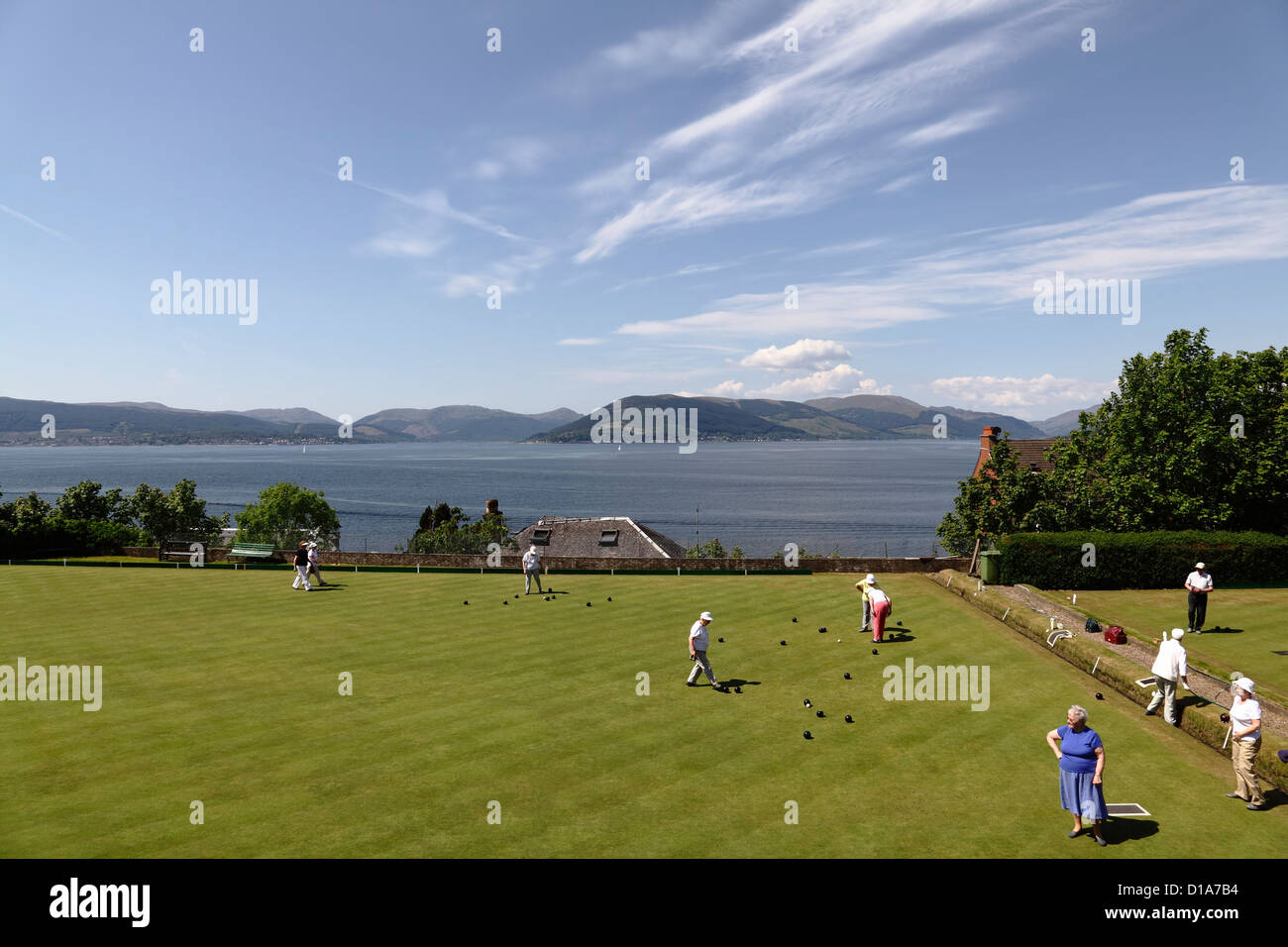 A game of lawn bowls being played at The Gourock Bowling Club beside the Firth of Clyde in Inverclyde, Scotland, UK Stock Photo