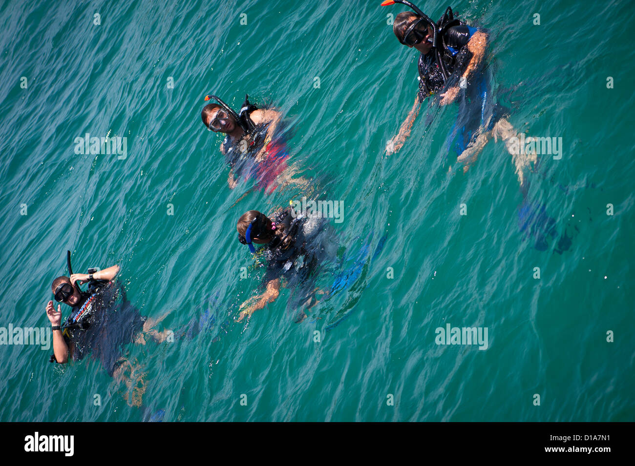 SCUBA divers entering the water before a dive, Pattaya, Thailand Stock Photo