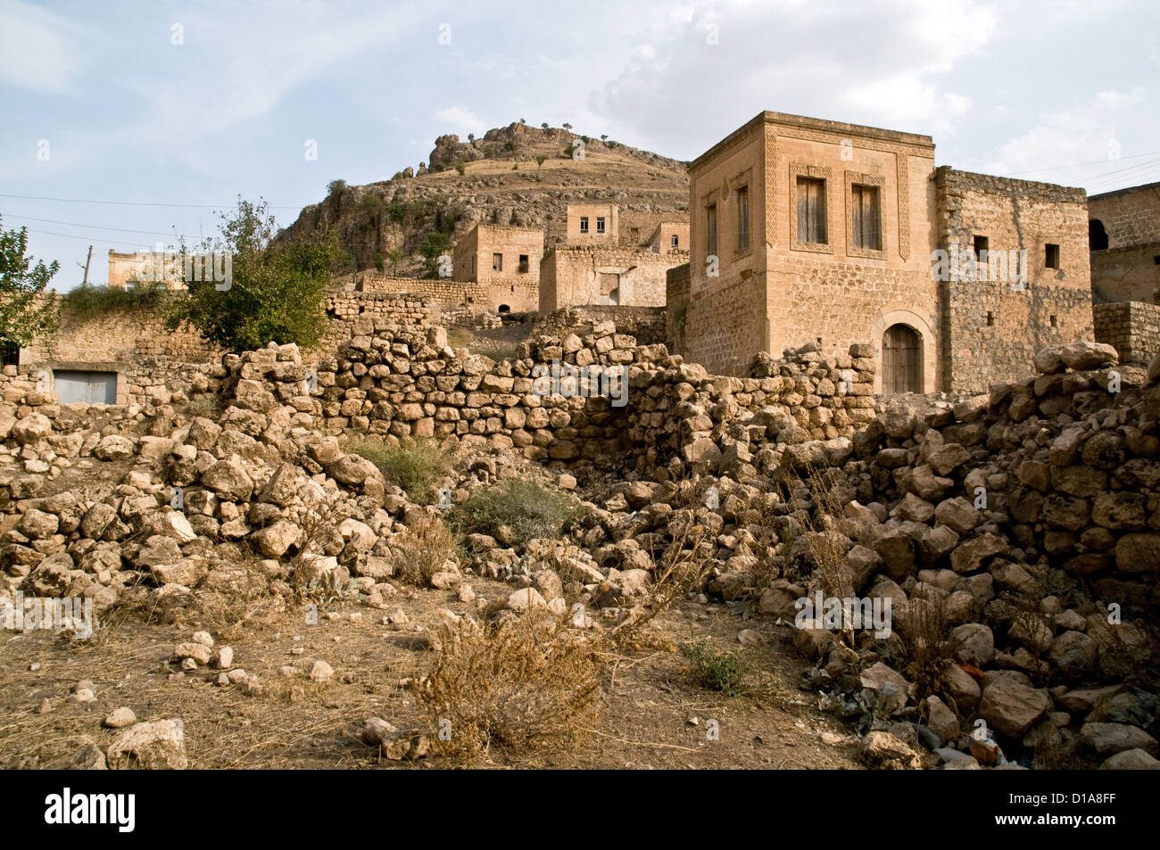 Honey-coloured stone houses in the ancient village of Dereici, in the Syriac Tur Abdin region of southeastern Turkey. Stock Photo
