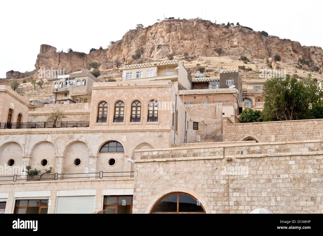 Homes built from stone nestled on a mountainside in the old quarter of the city of Mardin, in the eastern Anatolia region of southeast Turkey. Stock Photo