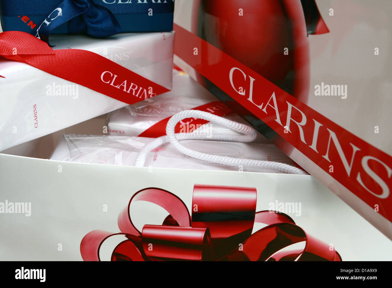 Part of two Clarins bags and wrapped Clarins gifts Stock Photo Alamy
