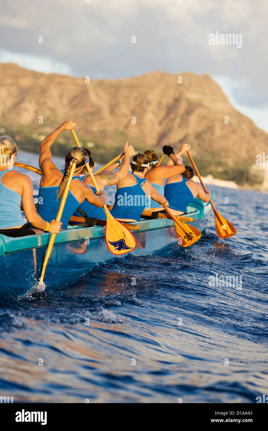 Hawaii, Oahu, Female Outrigger Canoe Team Paddling Towards Diamond Head