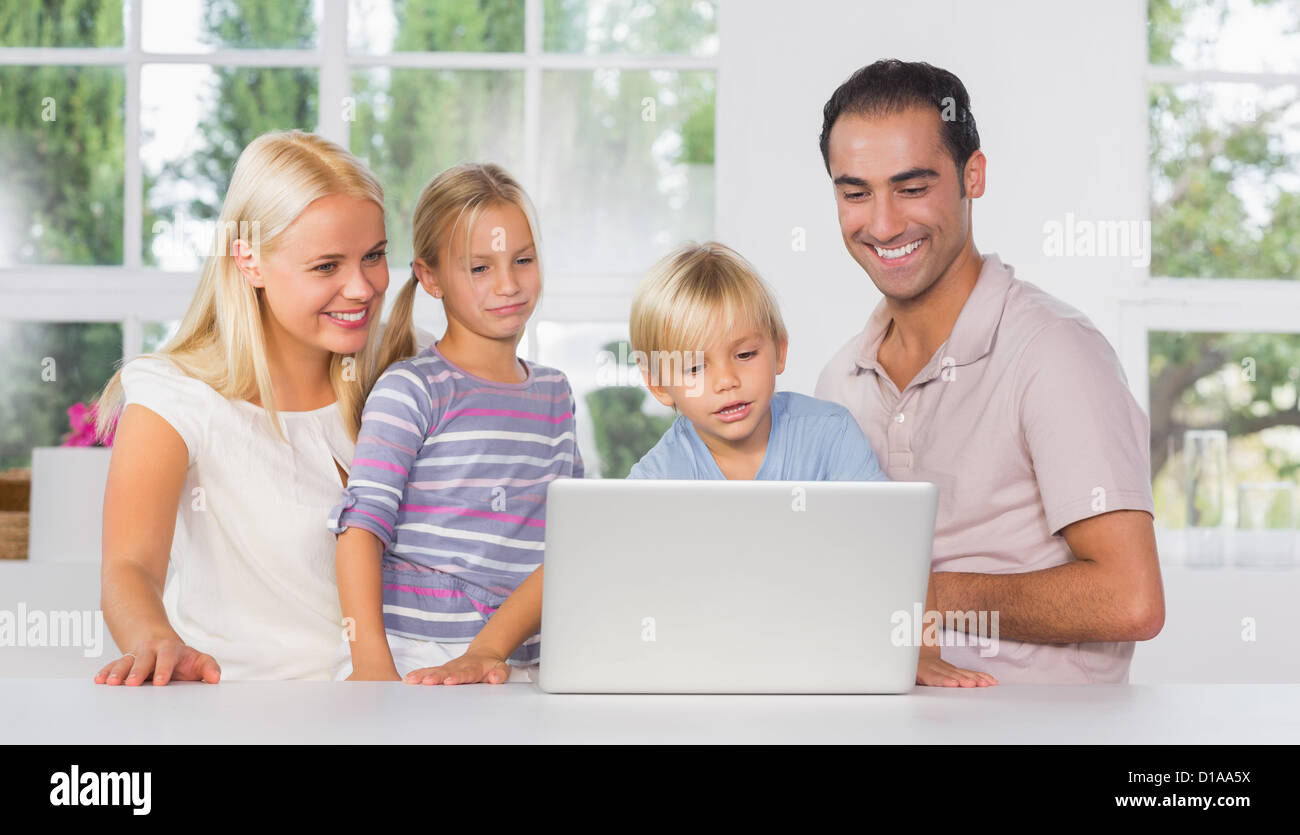 Family using a laptop together Stock Photo - Alamy