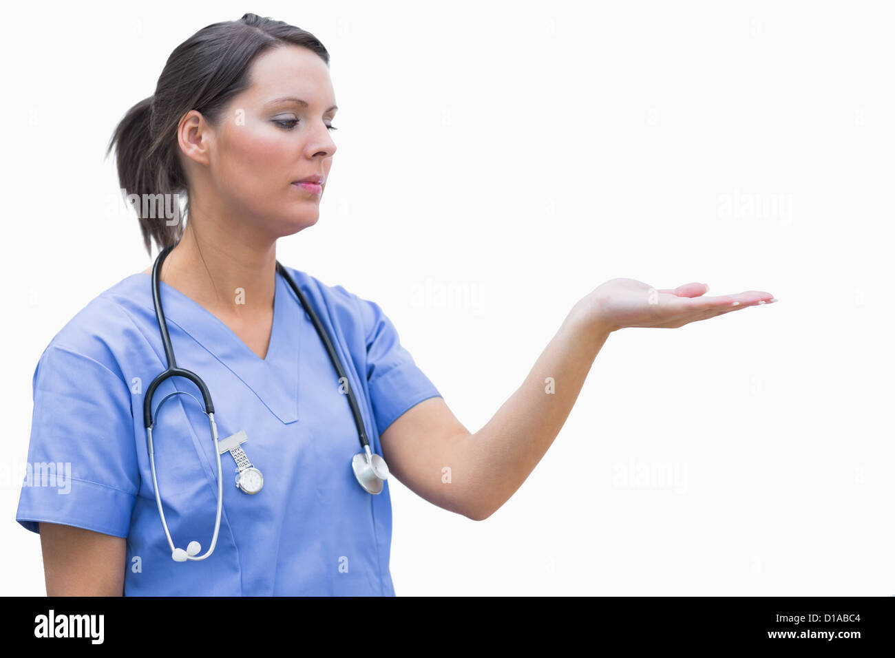 Female surgeon holding out open palm Stock Photo