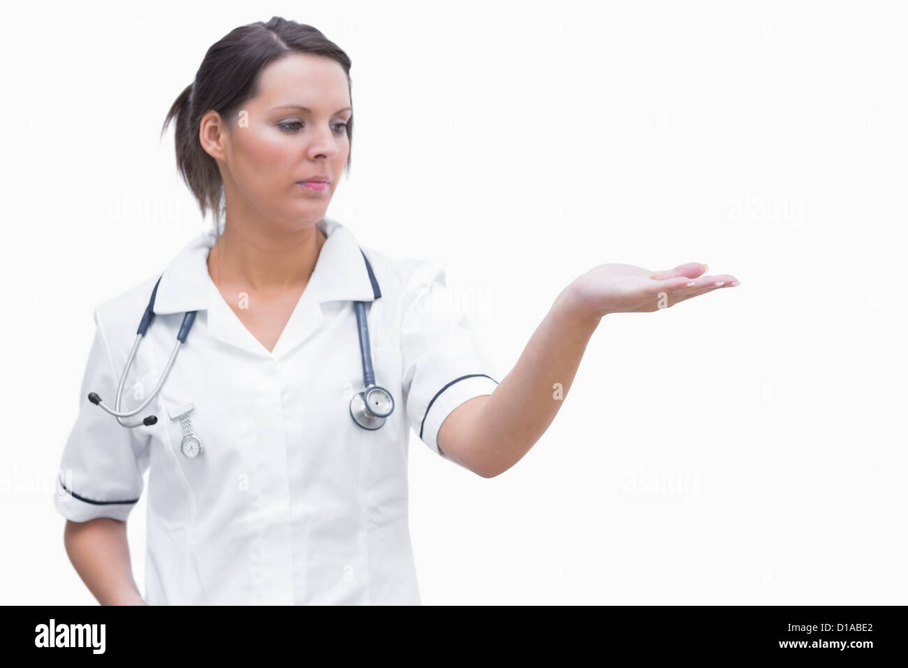 Female nurse holding out open palm Stock Photo