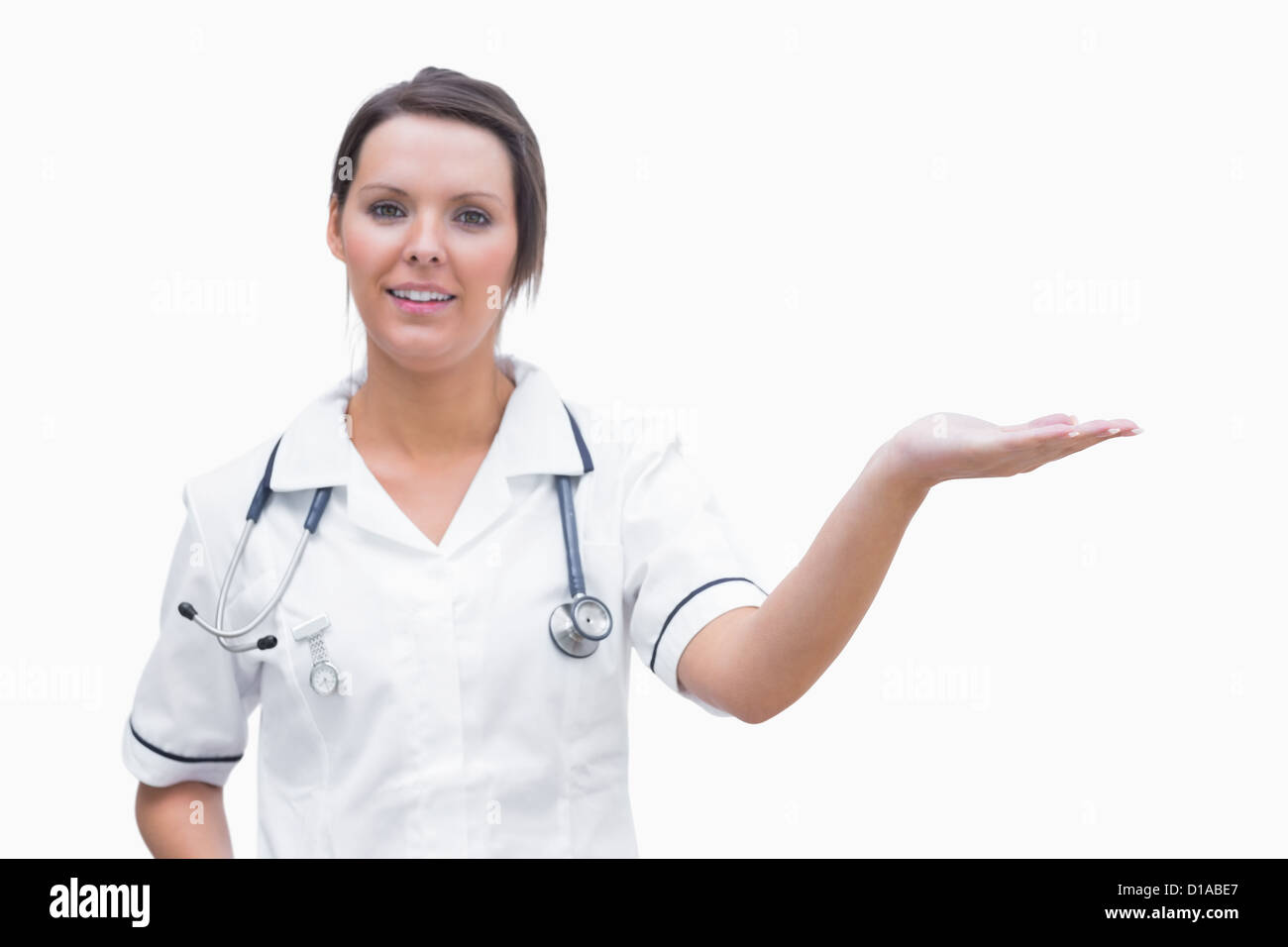 Portrait of female nurse holding out open palm Stock Photo