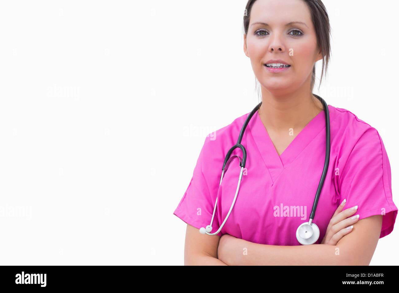 Portrait of smiling nurse standing with arms crossed Stock Photo - Alamy