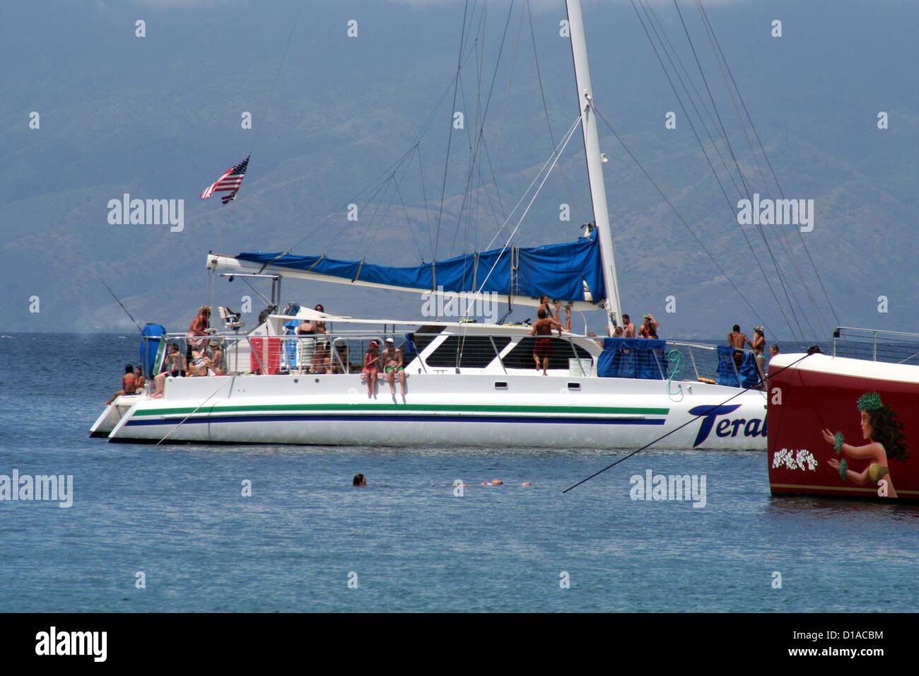 Tourists on catamarans and snorkelers in Honolua Bay, Maui Island, Hawaii, USA Stock Photo