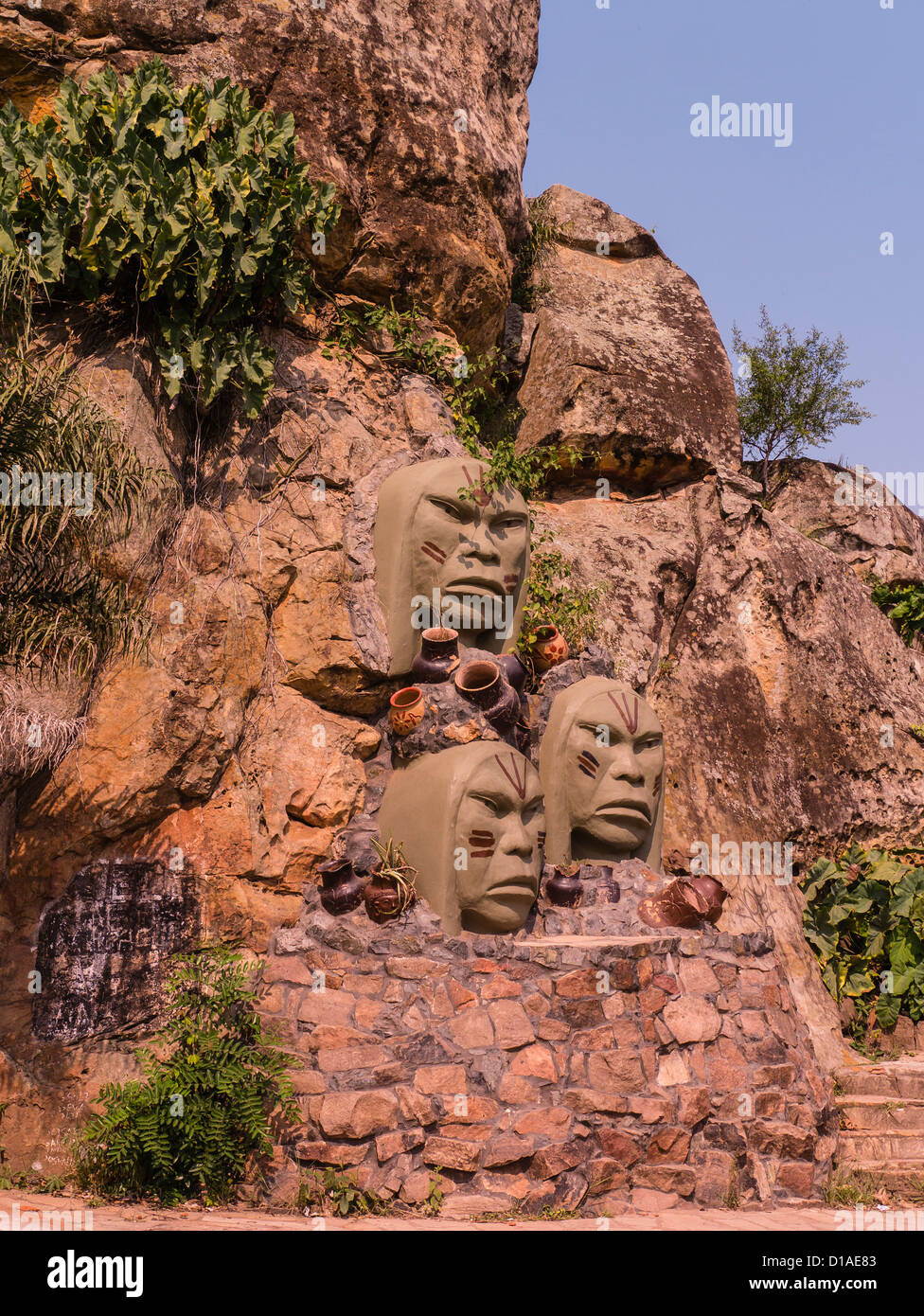 Tres Caras de Indios Monument in Tobatí, Paraguay that features three large sculpted faces of indigenous people. Stock Photo