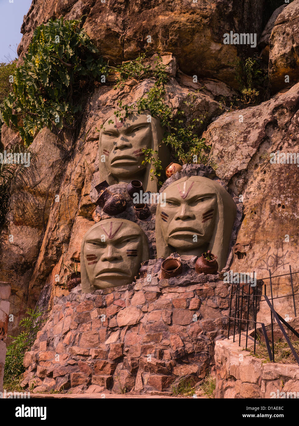 Tres Caras de Indios Monument in Tobatí, Paraguay that features three large sculpted faces of the indigenous people. Stock Photo