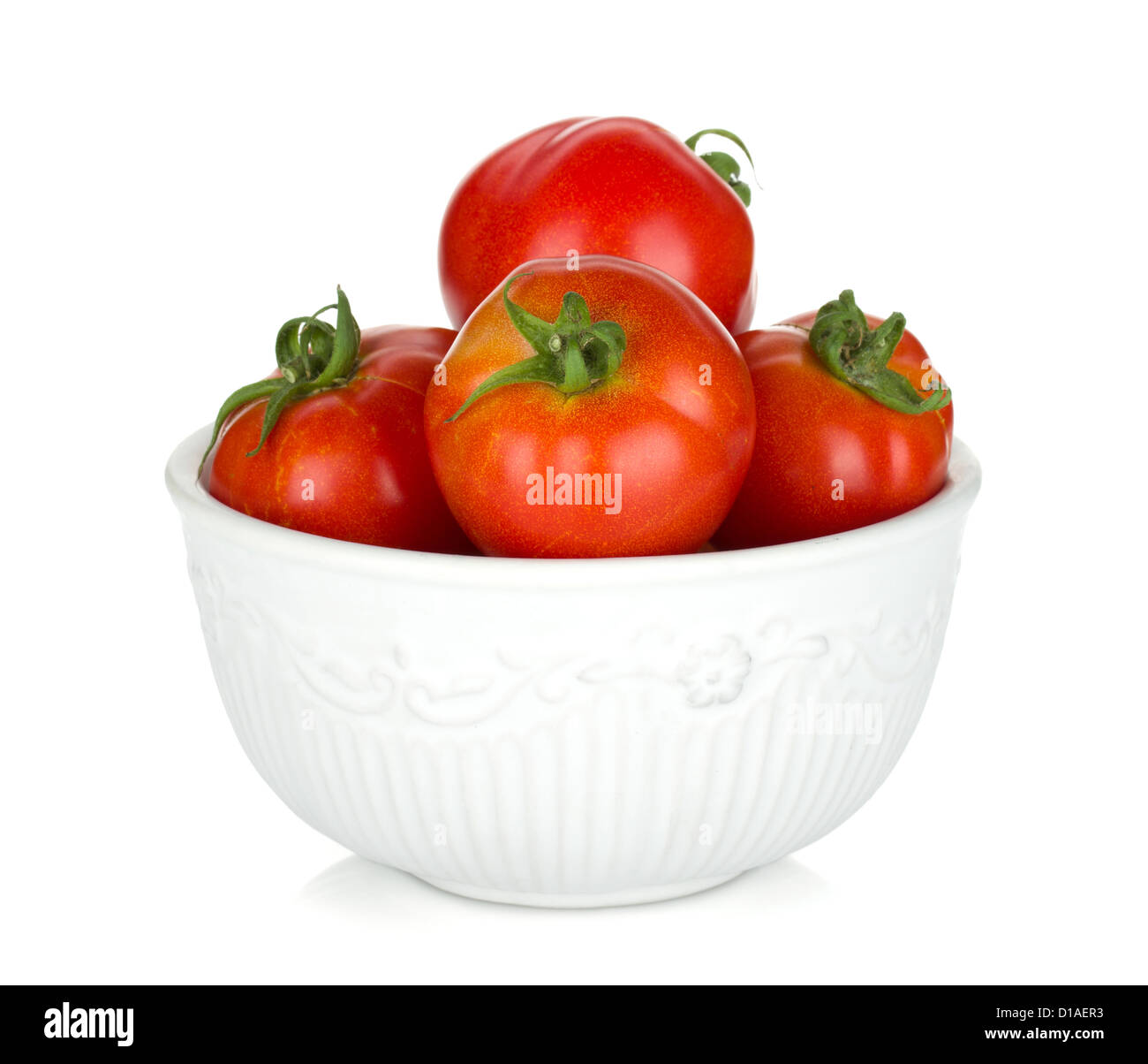 Ripe tomatoes in a bowl. Isolated on white background Stock Photo - Alamy