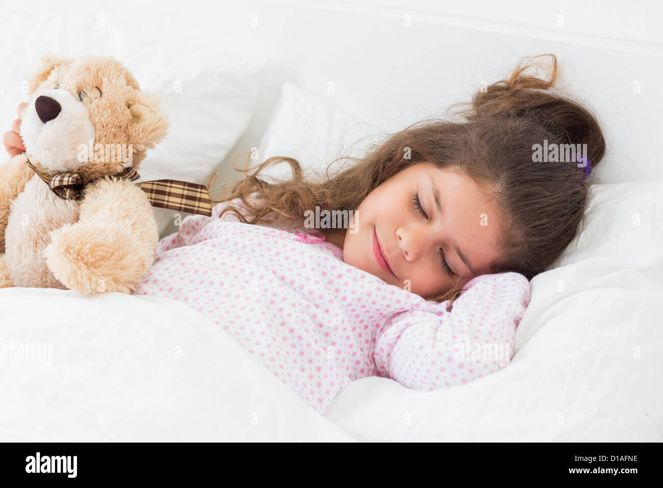 Cute girl asleep with teddy bear Stock Photo - Alamy