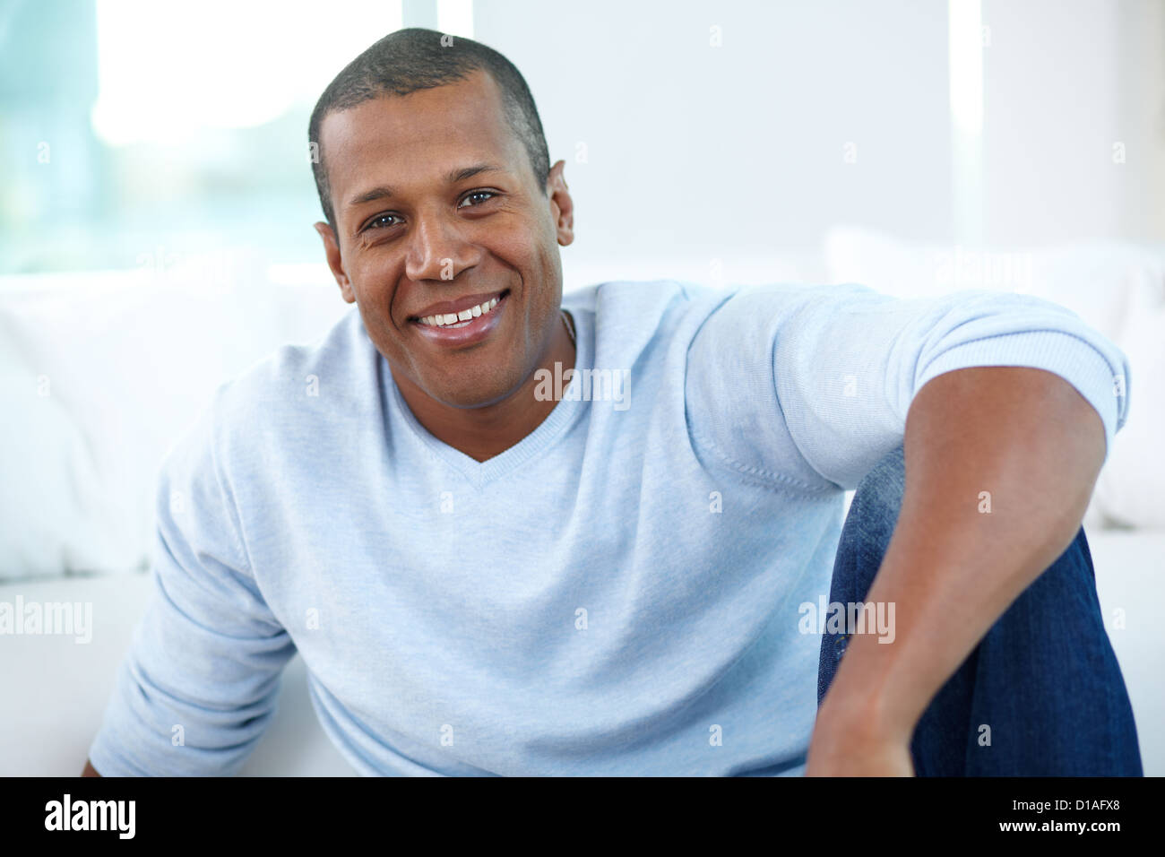 Image of young African man looking at camera with smile Stock Photo - Alamy
