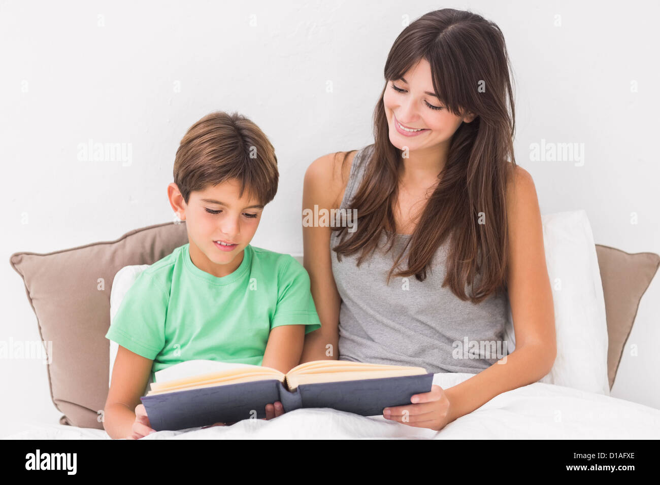 Mother and son reading in bed Stock Photo Alamy