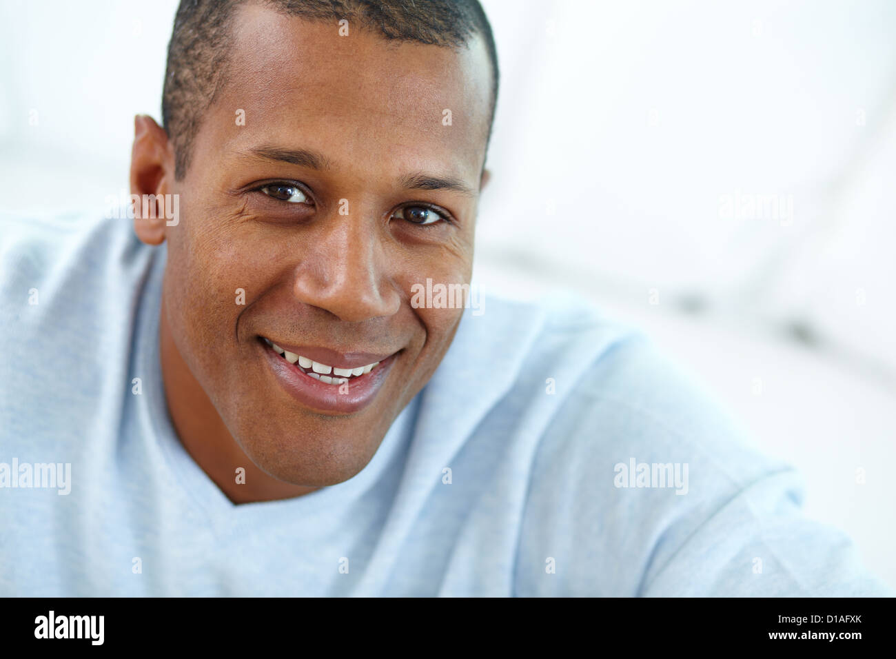 Image of young African man looking at camera with smile Stock Photo - Alamy