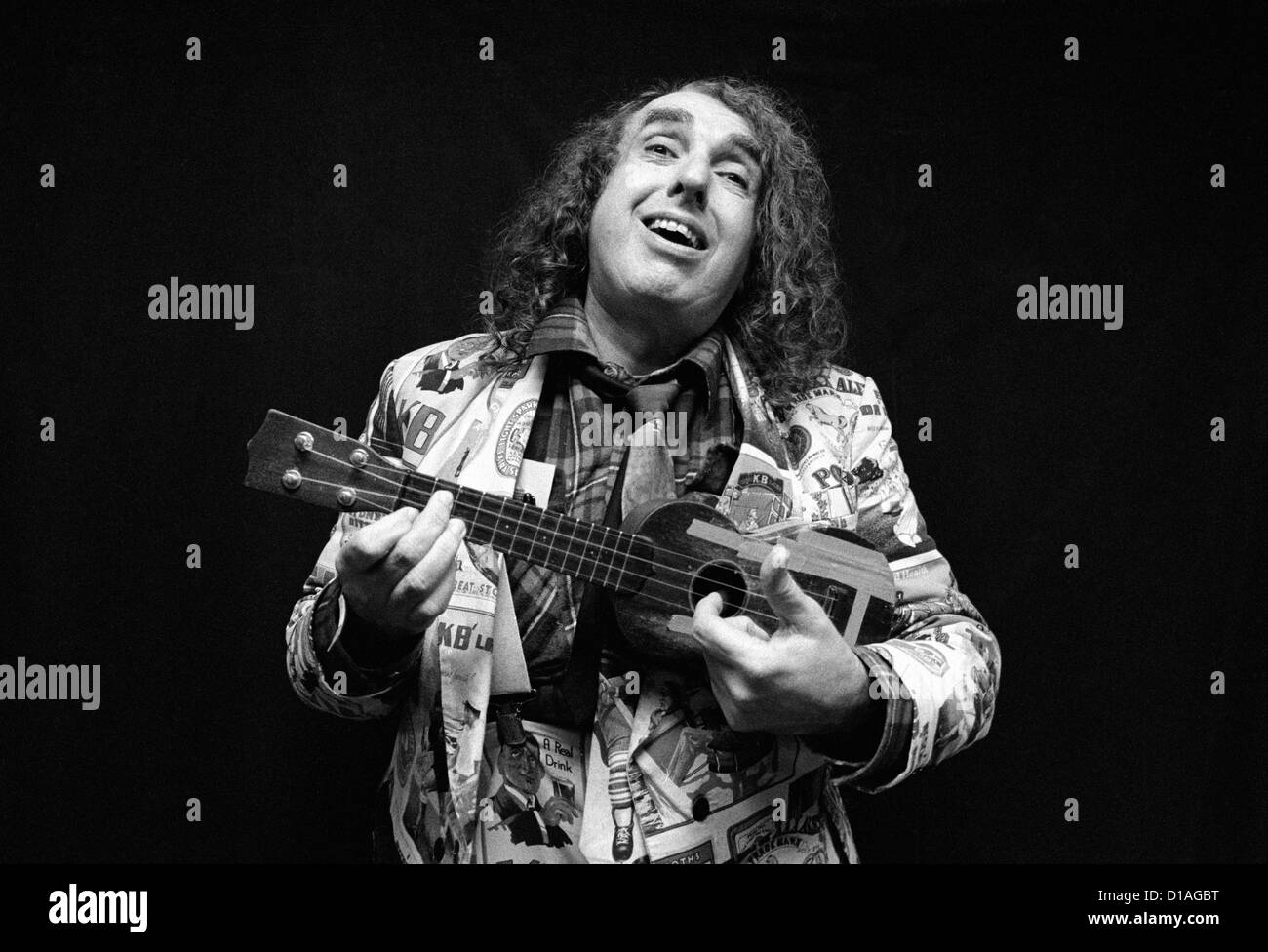 Tiny Tim, playing ukulele and smiling. Stock Photo