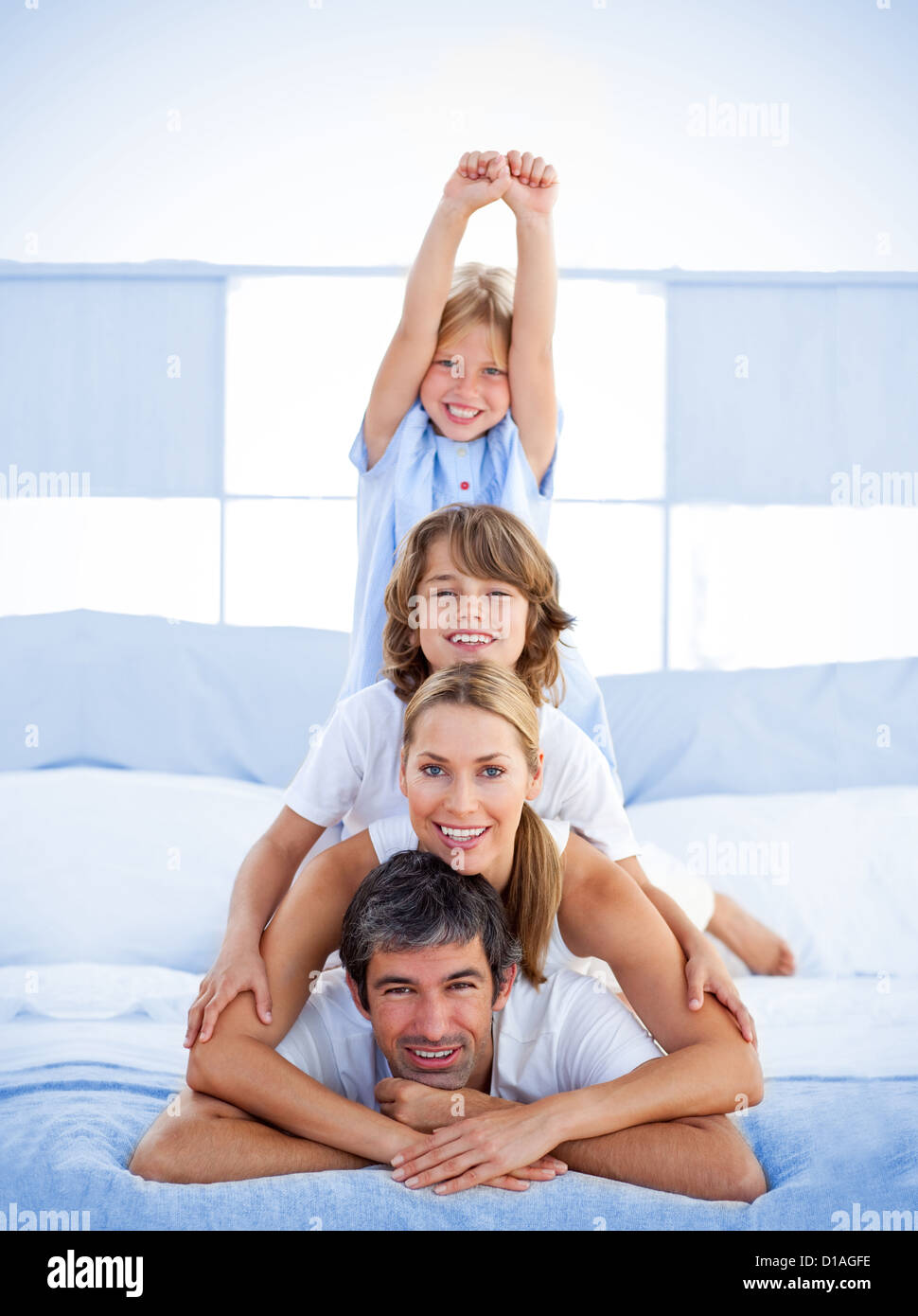 Jolly happy family having fun Stock Photo - Alamy