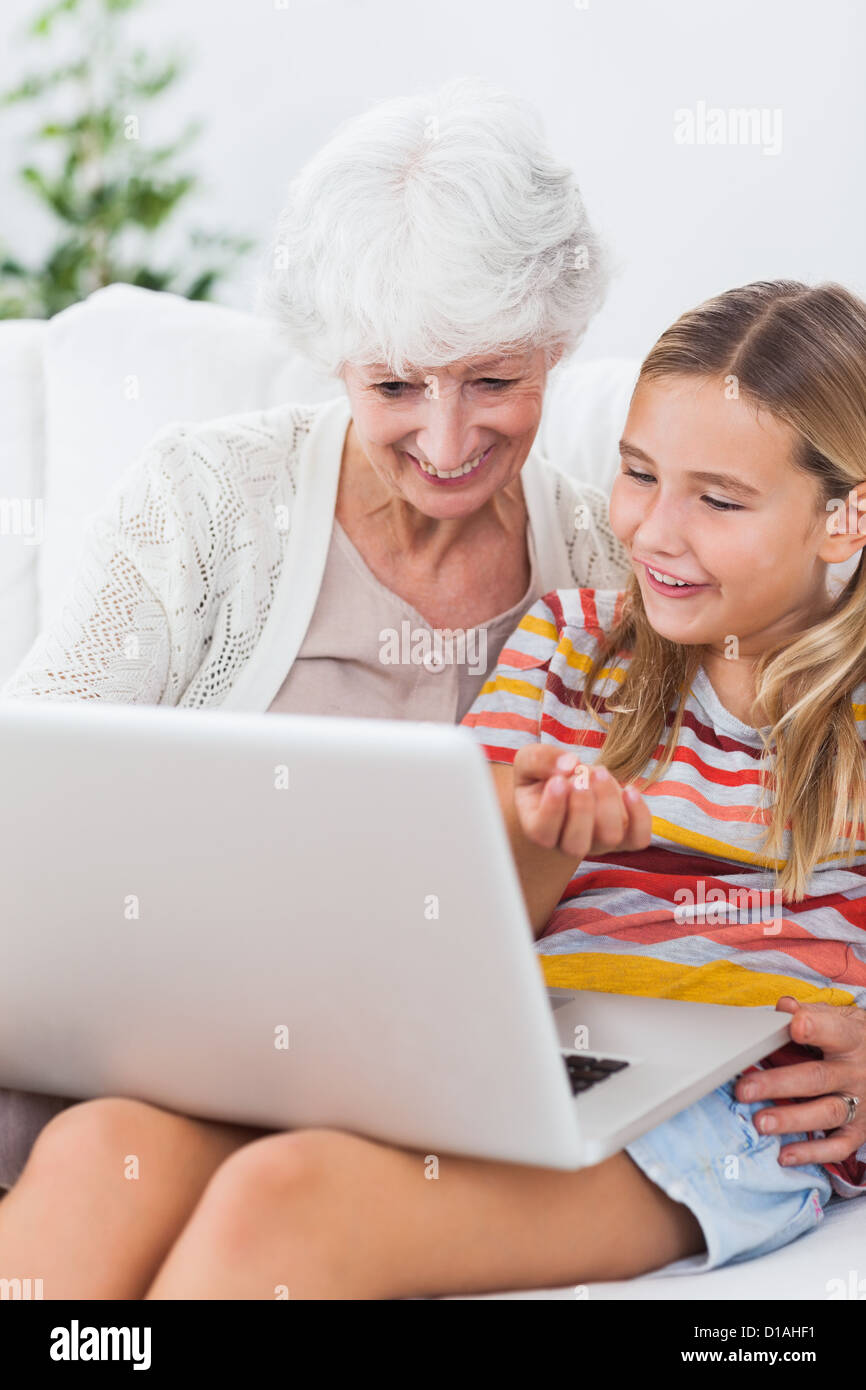 Granny and little girl using laptop Stock Photo - Alamy