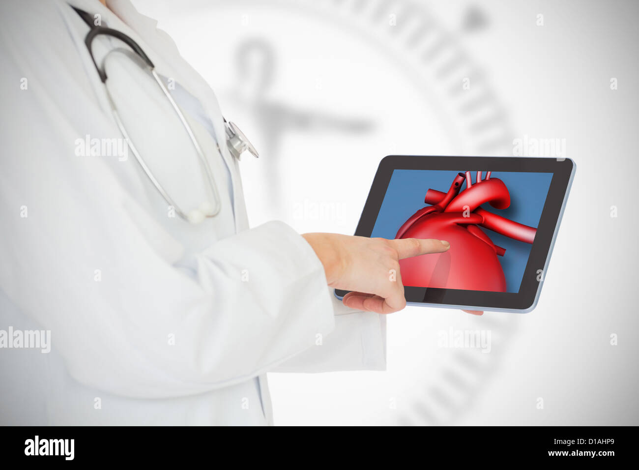 Doctor showing her tablet with red heart Stock Photo - Alamy