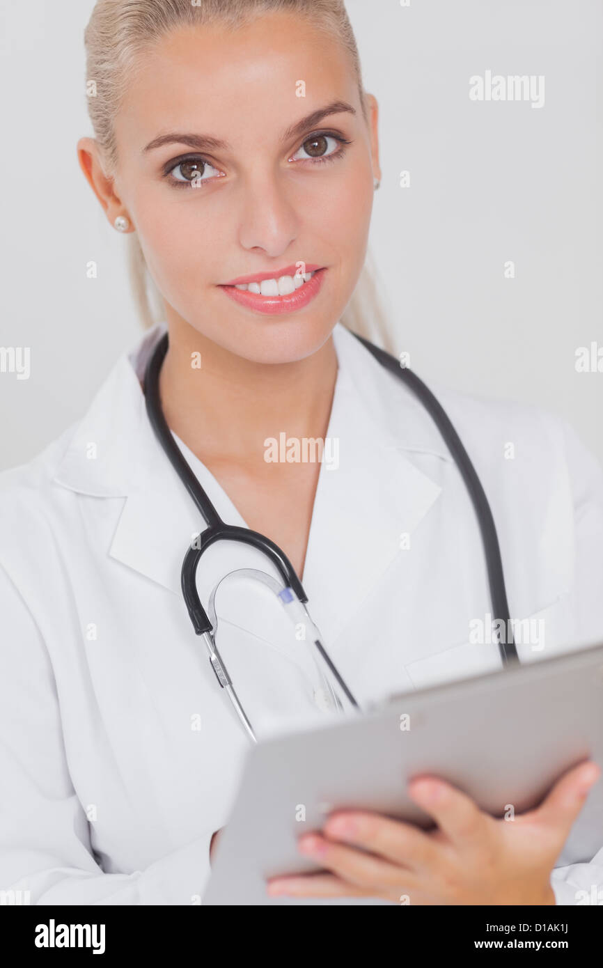 Doctor woman happy tablet hi-res stock photography and images - Alamy