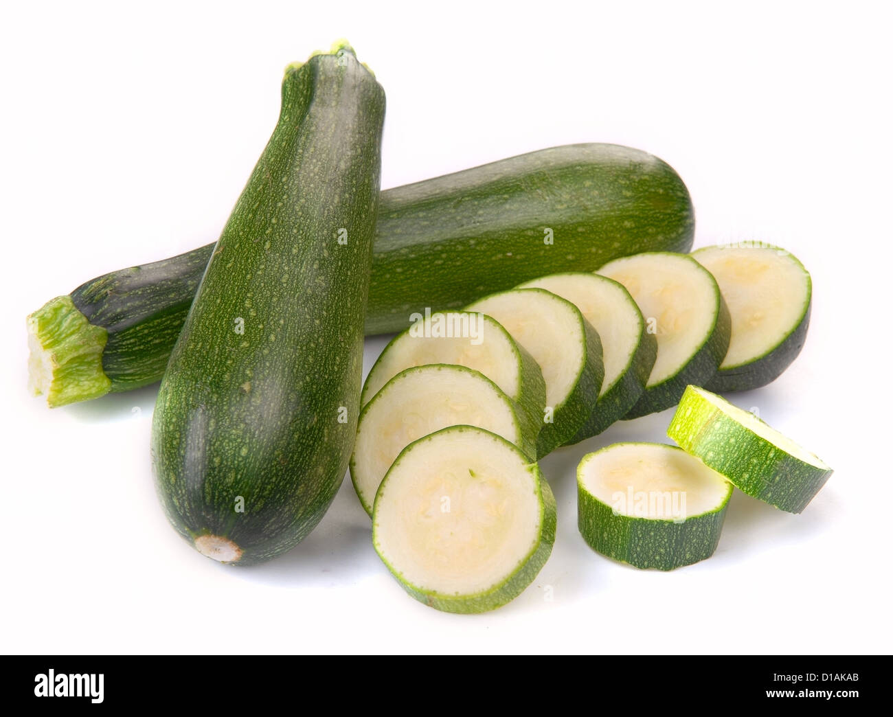 courgette with slices on a white background Stock Photo