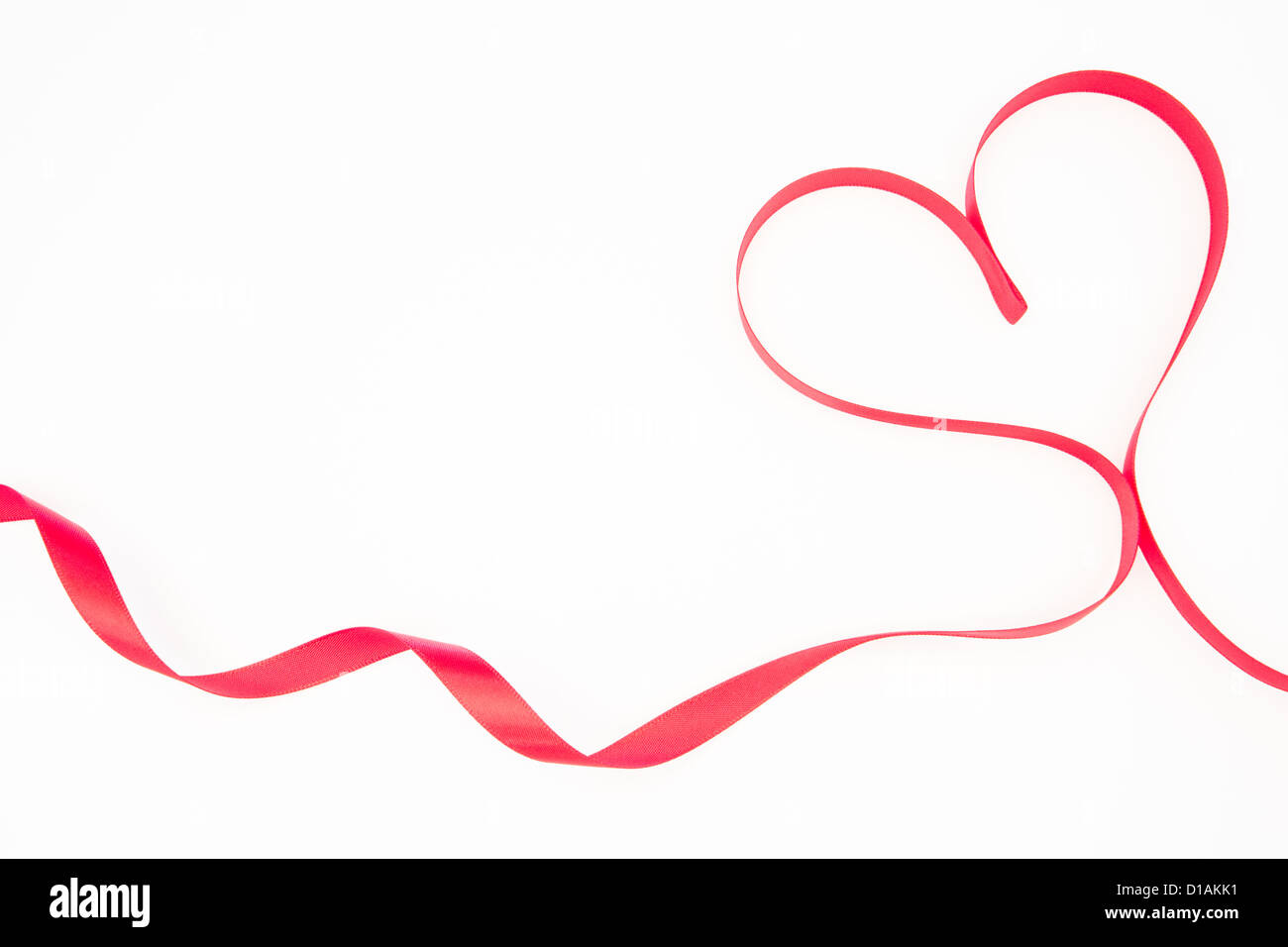 Pink ribbon shaped into heart with copy space Stock Photo - Alamy