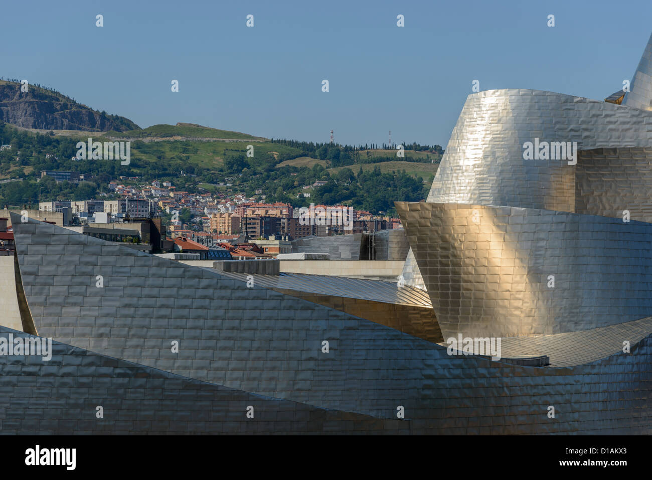 Cutoff of the Guggenheim Bilbao museum, with town in background. Stock Photo