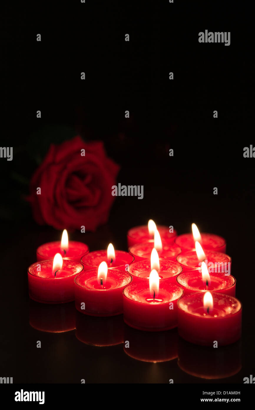 Romantic candles with red rose Stock Photo - Alamy