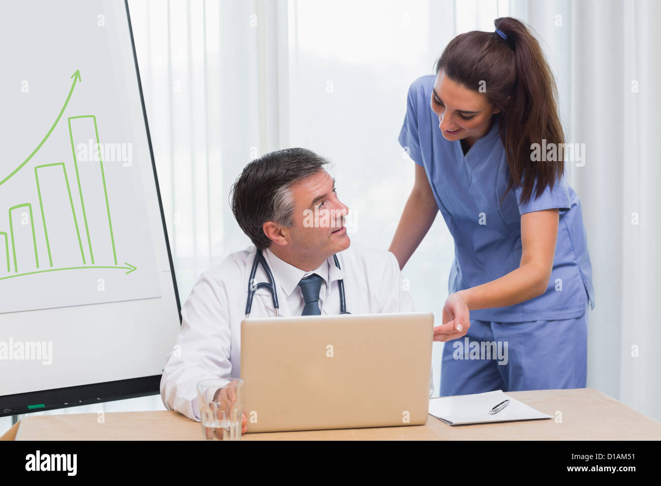Man nurse typing laptop hi-res stock photography and images - Alamy